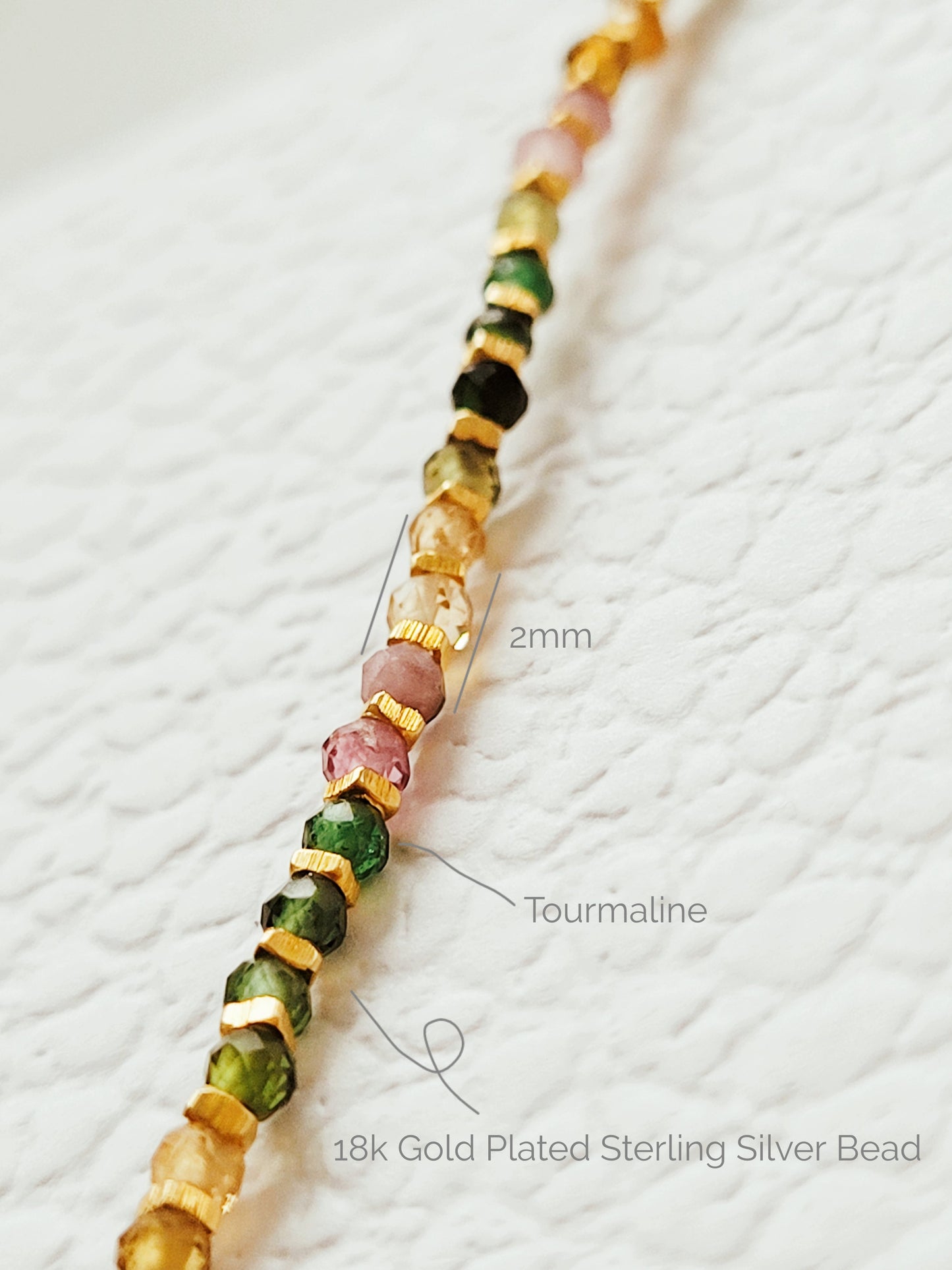 A minimalist gold bracelet with colorful tourmaline gemstone beads and gold plated beads, perfect for layering and stacking. Idea anniversary gift for her.