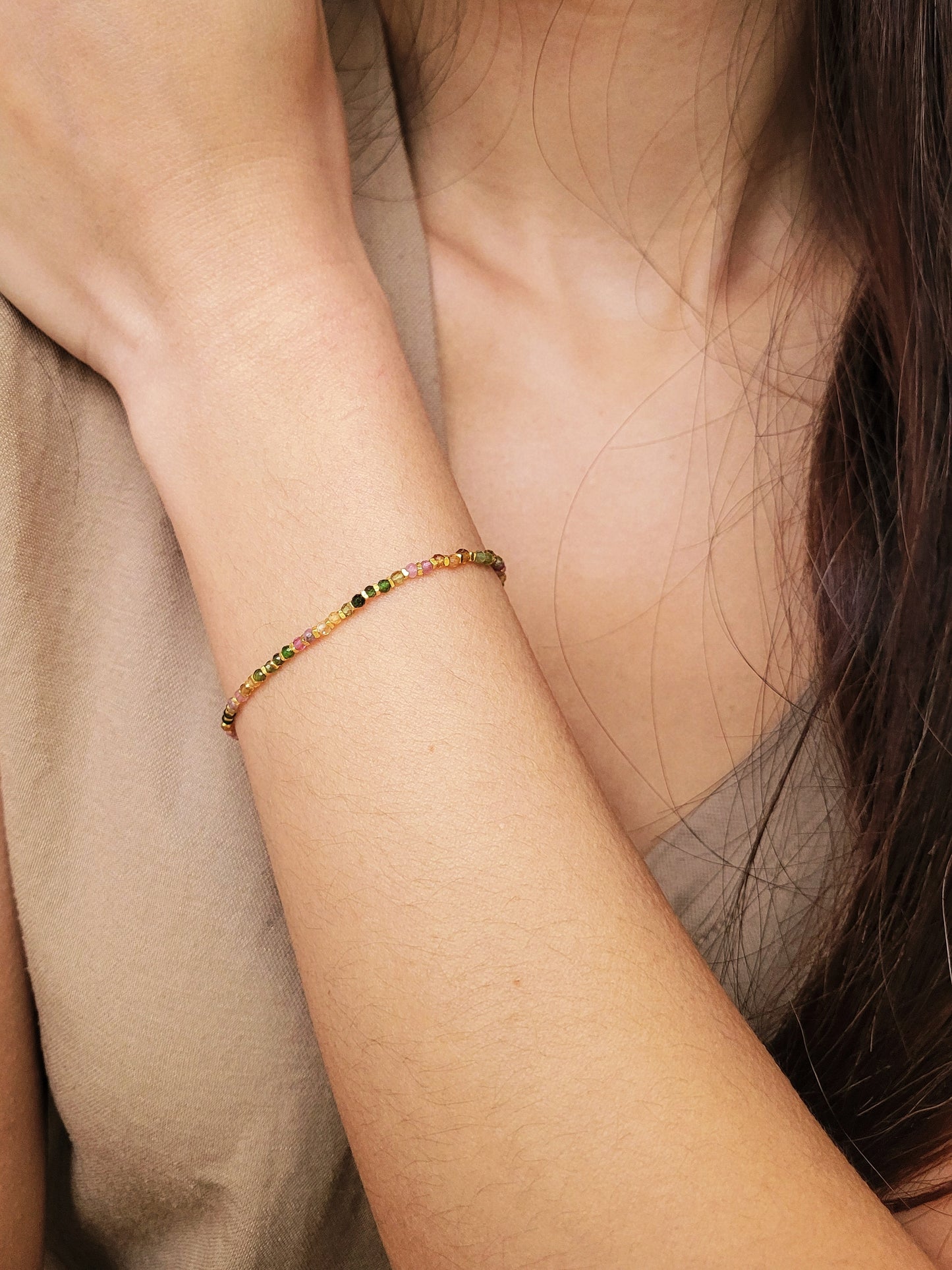 A minimalist gold bracelet with colorful tourmaline gemstone beads and gold plated beads, perfect for layering and stacking. Idea birthday gift for her.