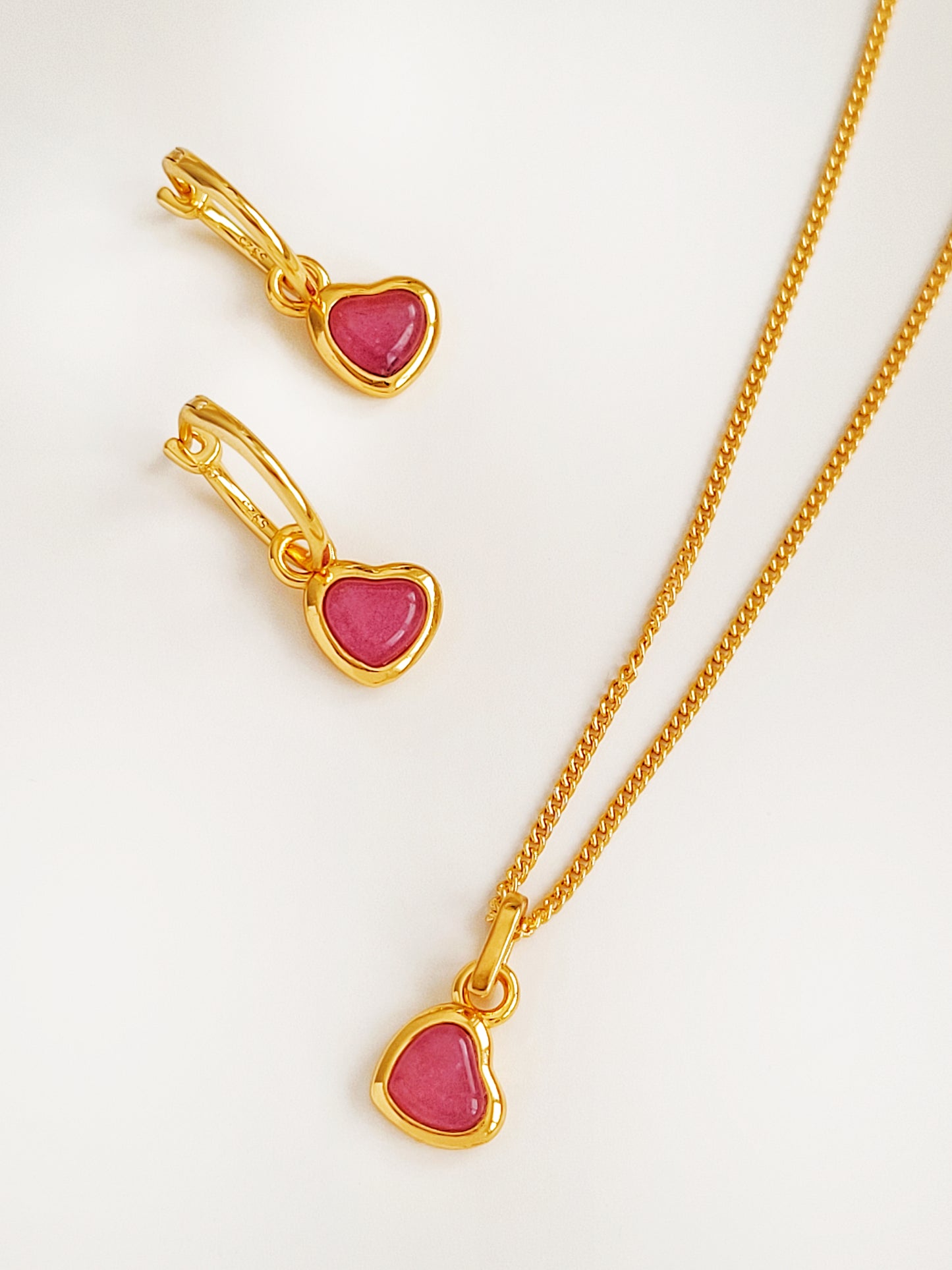 A set of pink heart earrings and necklace, perfect jewellery gift for her
