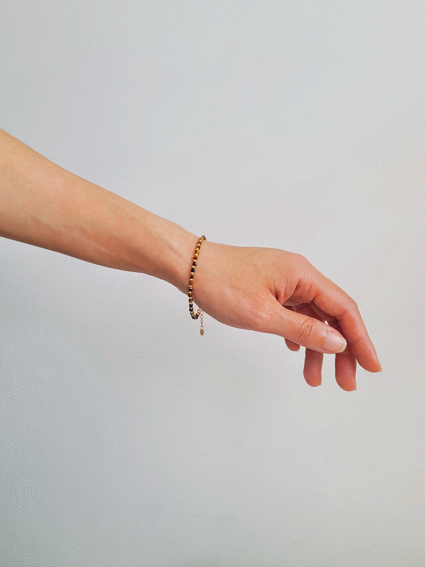 Handmade gemstone bracelet featuring cube-cut Tiger’s Eye and 22k gold vermeil