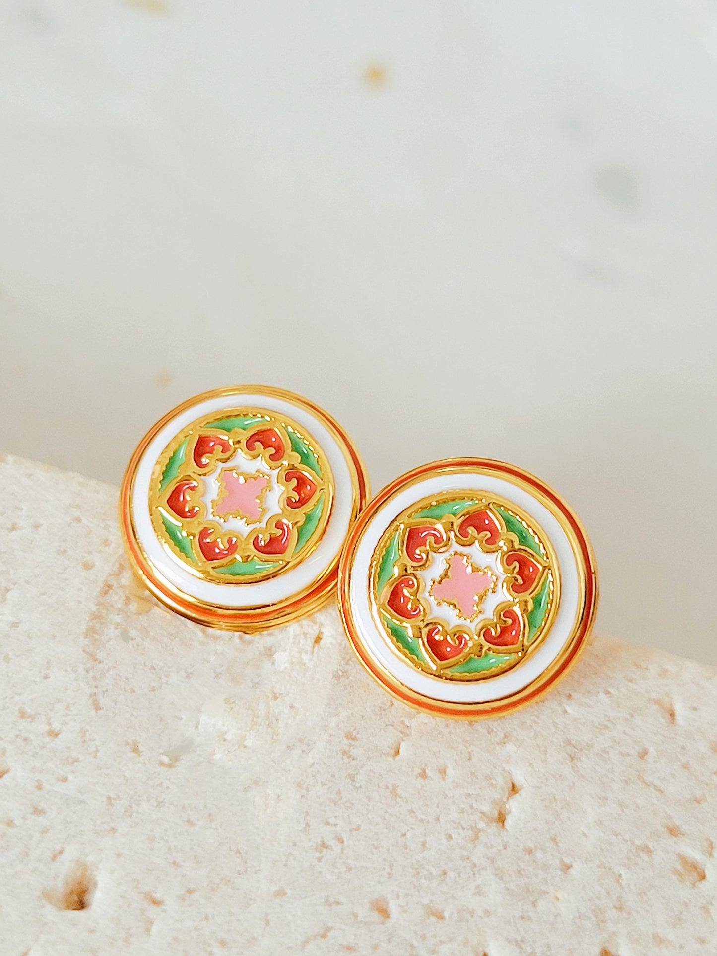 Gold-plated enamel stud earrings with vintage-inspired floral design in pink, green, and red, styled after classic Victorian ceramic tiles.