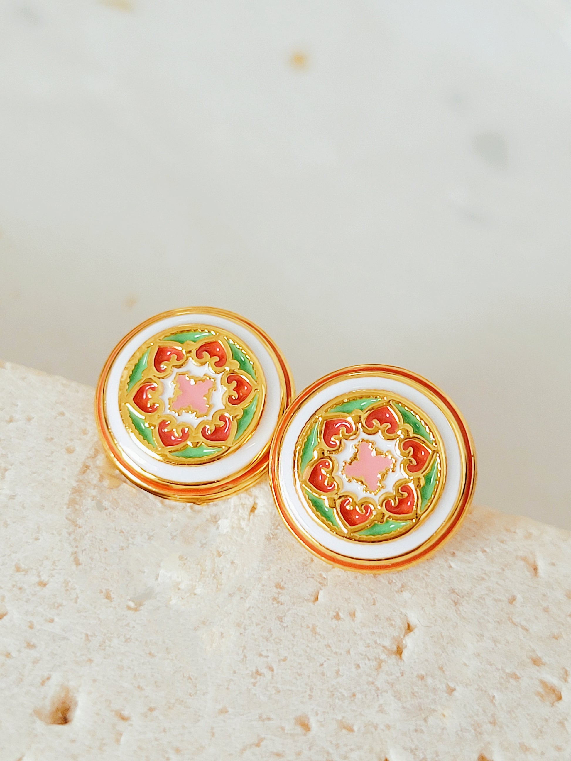 Gold-plated enamel stud earrings with vintage-inspired floral design in pink, green, and red, styled after classic Victorian ceramic tiles.