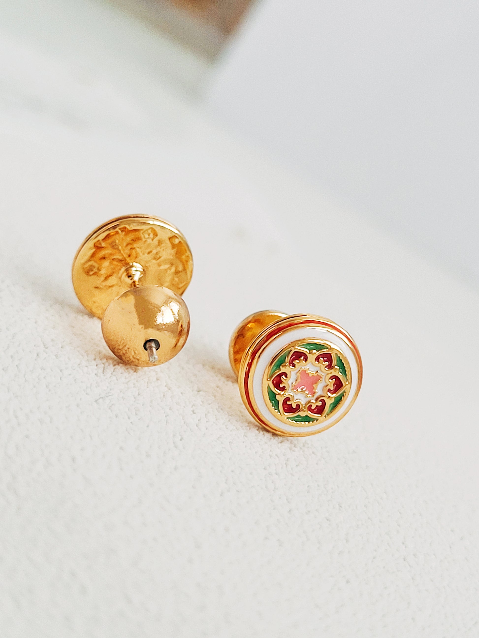 Gold-plated enamel stud earrings with vintage-inspired floral design in pink, green, and red, styled after classic Victorian ceramic tiles.
