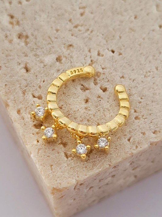 A gold-plated Earring featuring three small diamonds, showcasing elegance and sparkle in a simple design.