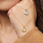 Elegant woman wearing a dainty 18K gold plated sterling silver circle pendant necklace with shimmering cubic zirconia accents, perfect for everyday wear and special occasions.