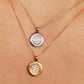Elegant woman wearing a dainty 18K gold plated sterling silver circle pendant necklace with shimmering cubic zirconia accents, perfect for everyday wear and special occasions.