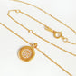 A dainty 18K gold plated sterling silver circle pendant necklace with shimmering cubic zirconia accents, perfect for everyday wear and special occasions.