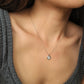 Elegant woman wearing a dainty sterling silver circle pendant necklace with shimmering cubic zirconia accents, perfect for everyday wear and special occasions.
