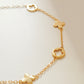 A dainty gold bracelet featuring van cleef clover motif, crafted in gold plated sterling silver.