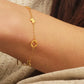 A dainty gold bracelet featuring van cleef clover motif, crafted in gold plated sterling silver.
