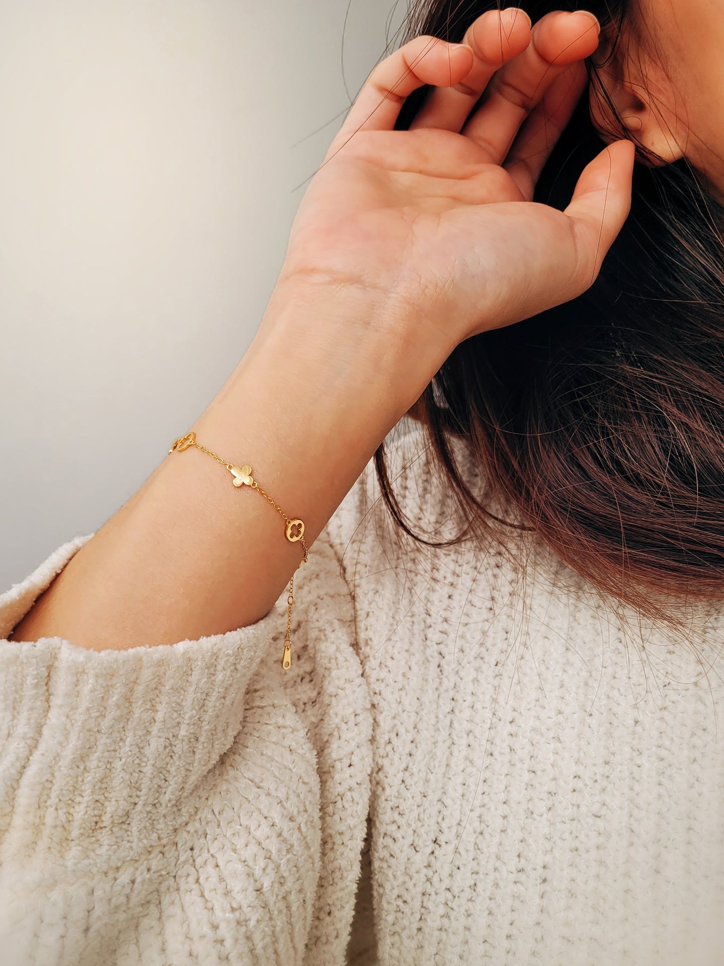 A dainty gold bracelet featuring van cleef clover motif, crafted in gold plated sterling silver.