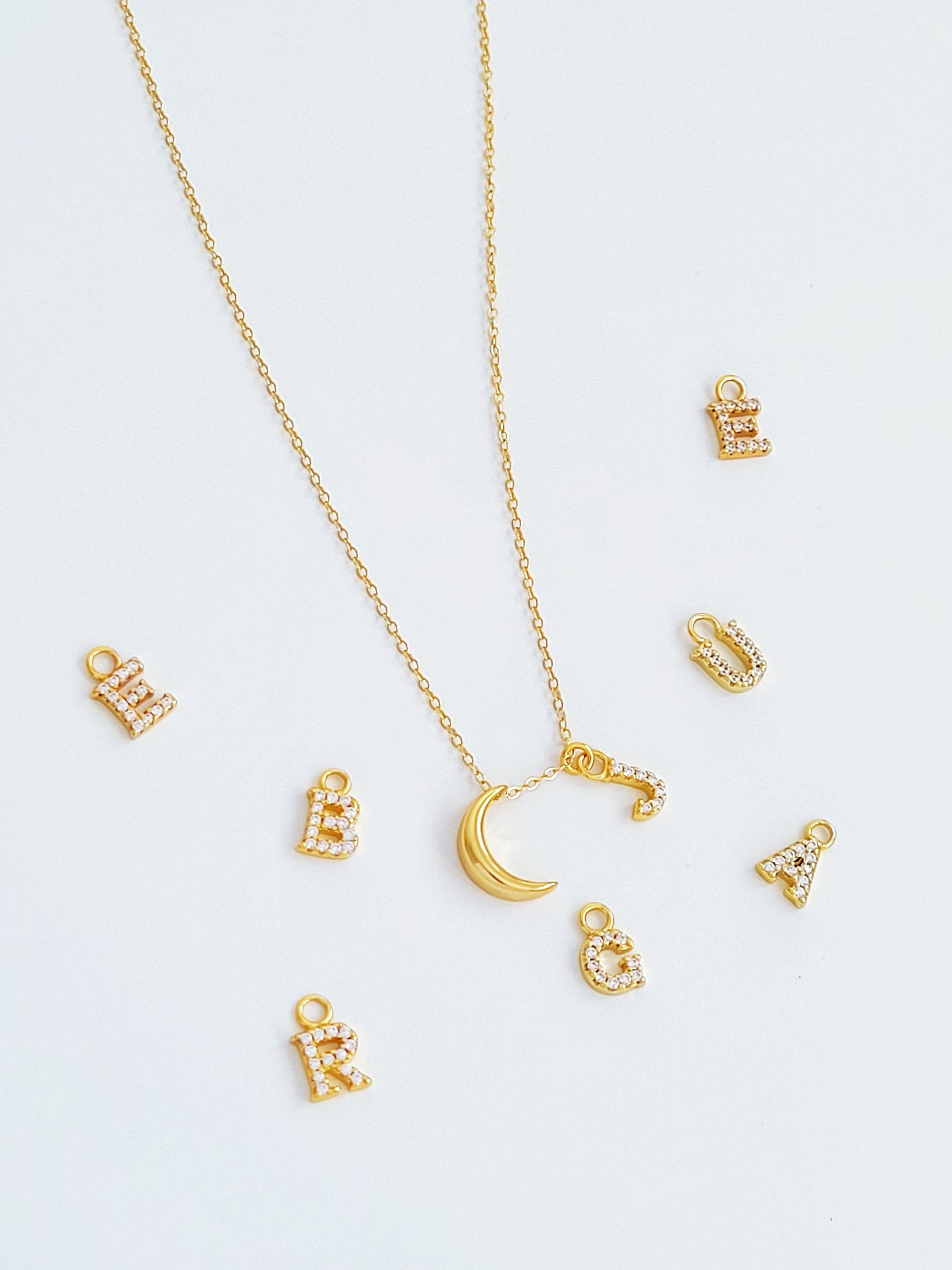 Personalised gold plated crescent initial charm necklace. Crafted in 18k gold vermeil, best valentines day gift for her.