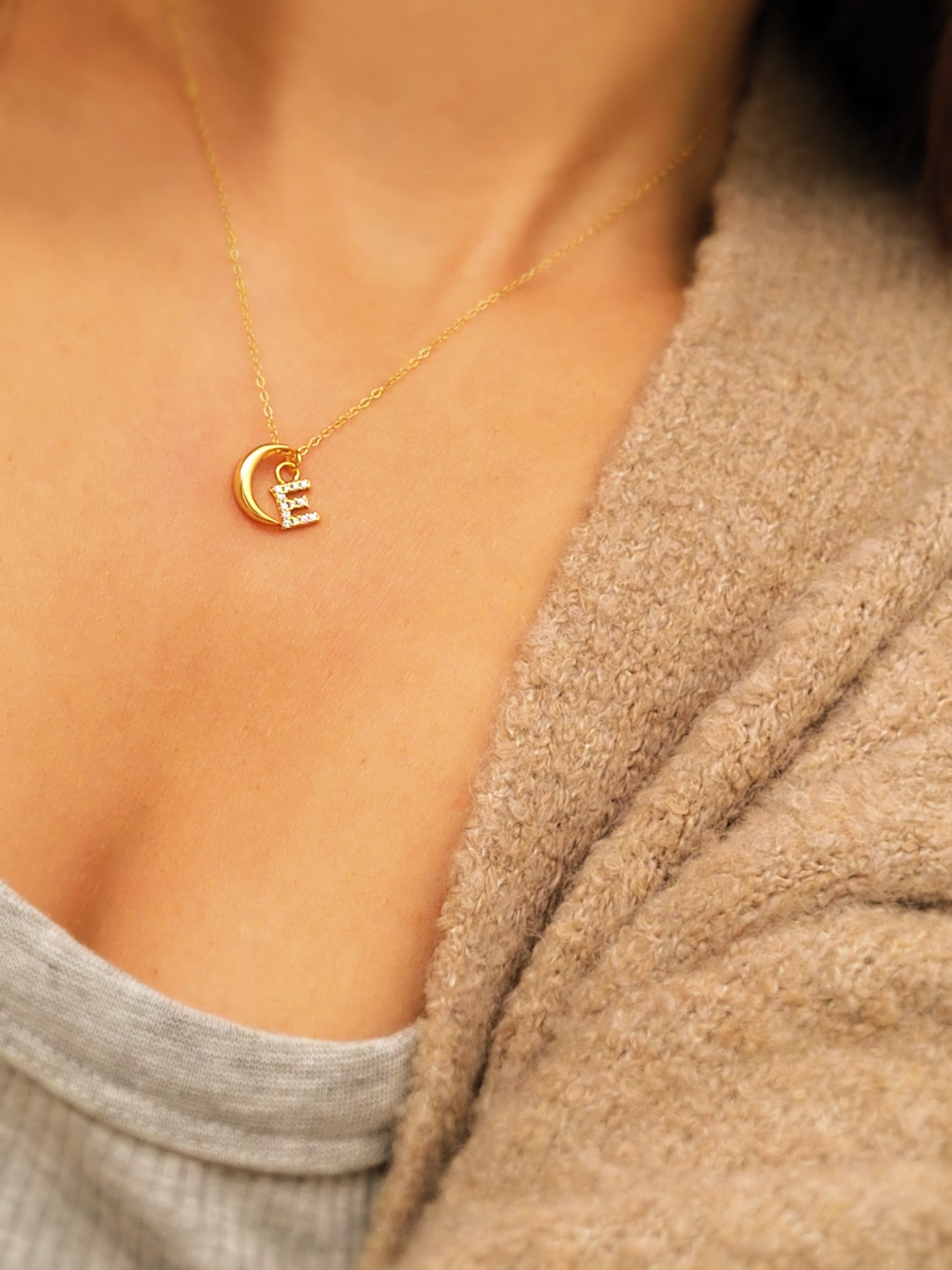 Model wearing custom gold plated crescent letter charm necklace. Crafted in 18k gold vermeil, best birthday gift for her.