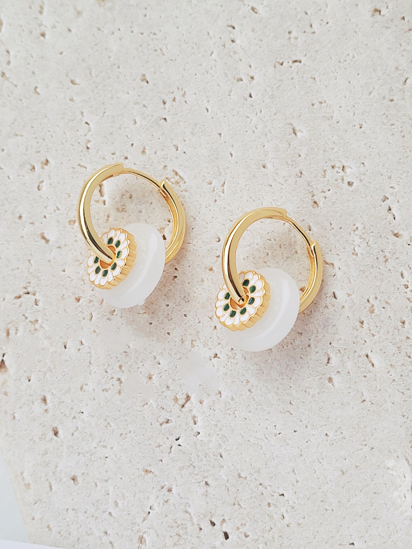 Stunning gold and white flower design earrings crafted in 18ct gold plated sterling silver and glass drop, showcasing a chic drop hoop style for a stylish accessory.