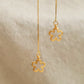 Close up of the flower dangle on the gold threader earrings, crafted in gold plated 925 sterling silver with hammered texture.