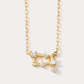 A dainty gold necklace with a pendant featuring a stylized Gemini zodiac constellation sign with sparkling zircons crafted in gold plated sterling silver. Ideal birthday gift for her.