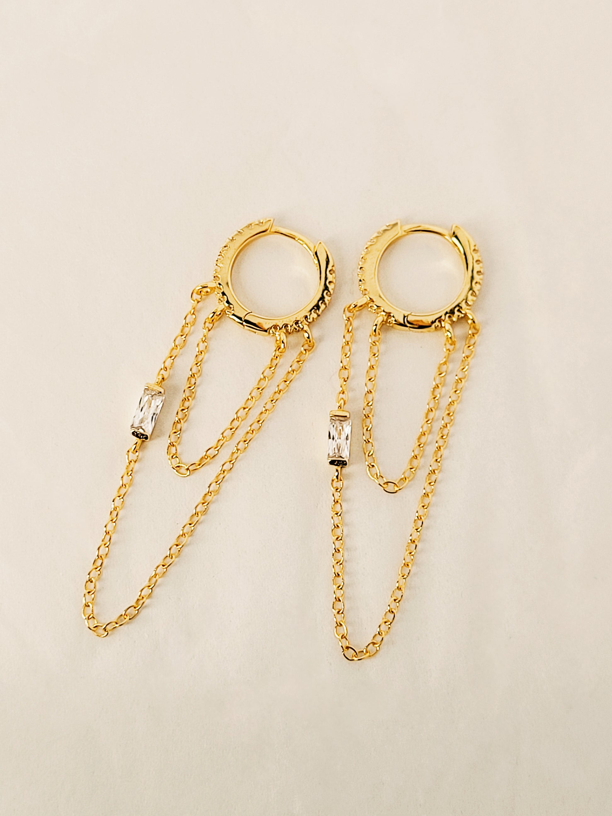 A pair of 14k gold chain huggie hoop earrings with double chain detail and diamond accent, perfect minimalist gold jewellery gift for her.