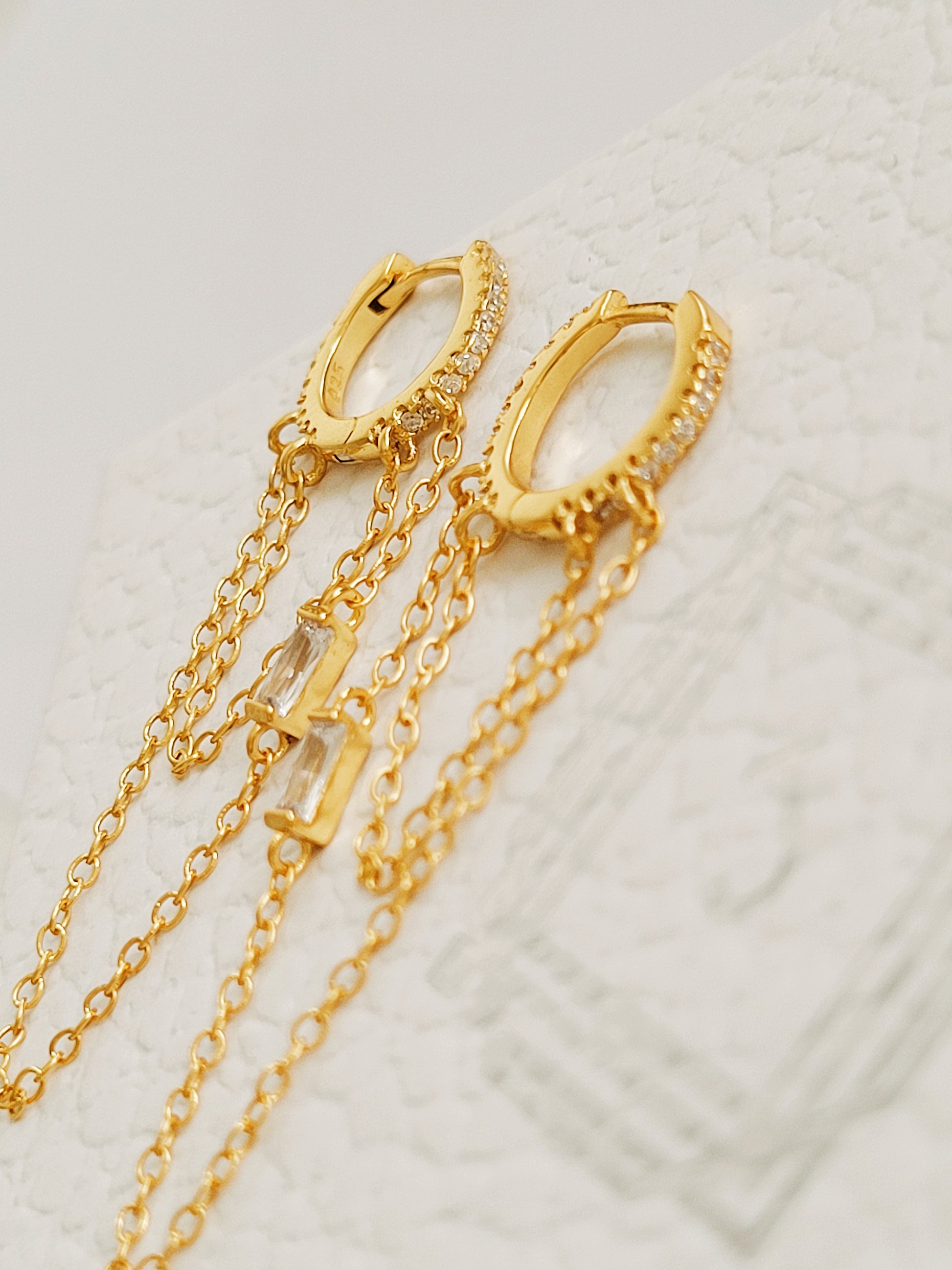 A pair of 14k gold chain huggie hoop earrings with double chain detail and diamond accent, perfect minimalist gold jewellery gift for her.