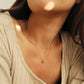 Luxurious close-up of a gold round shaped barrel necklace featuring sparkling pave zircons.