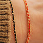 Gold-plated sterling silver string bracelets in Black, Blue, Red and Pink, perfect as friendship bracelets or meaningful graduation gifts for everyday wear.