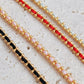 Gold-plated sterling silver string bracelets in Black, Blue, Red and Pink, perfect as friendship bracelets or meaningful graduation gifts for everyday wear.