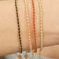 Gold-plated sterling silver string bracelets in Black, Blue, Red and Pink, perfect as friendship bracelets or meaningful graduation gifts for everyday wear.