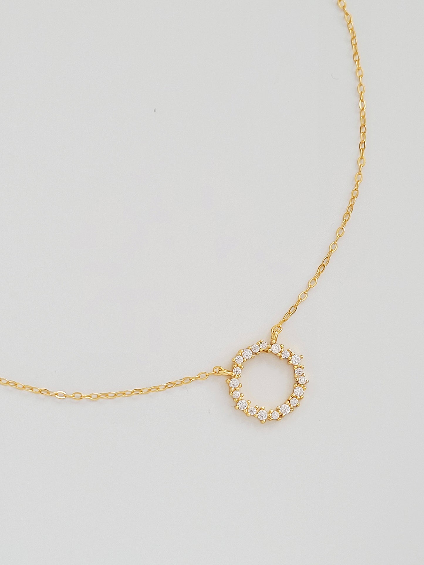 Gold Vermeil Infinity Circle Necklace displayed flat, highlighting the infinity circle pendant.