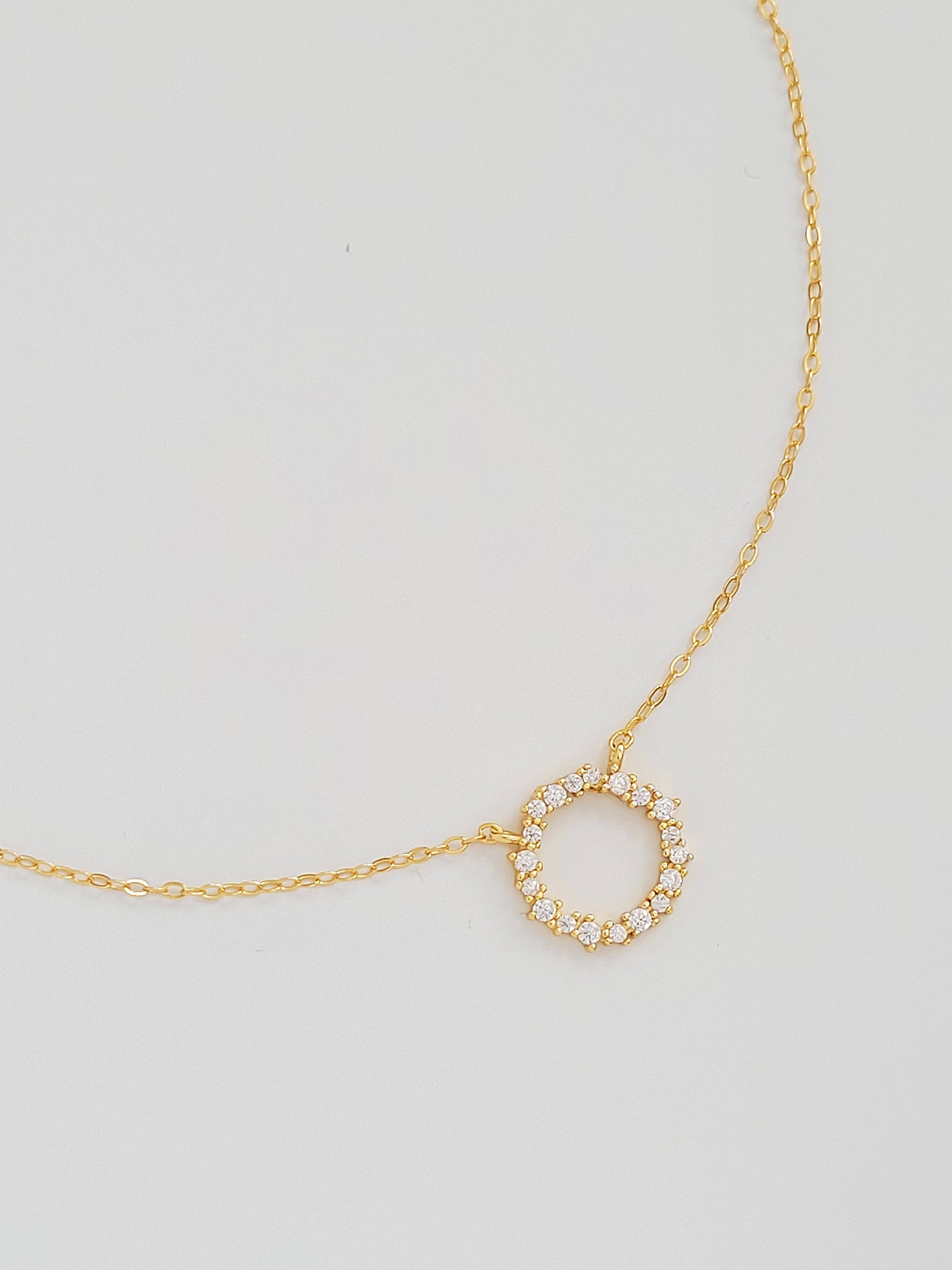 Gold Vermeil Infinity Circle Necklace displayed flat, highlighting the infinity circle pendant.