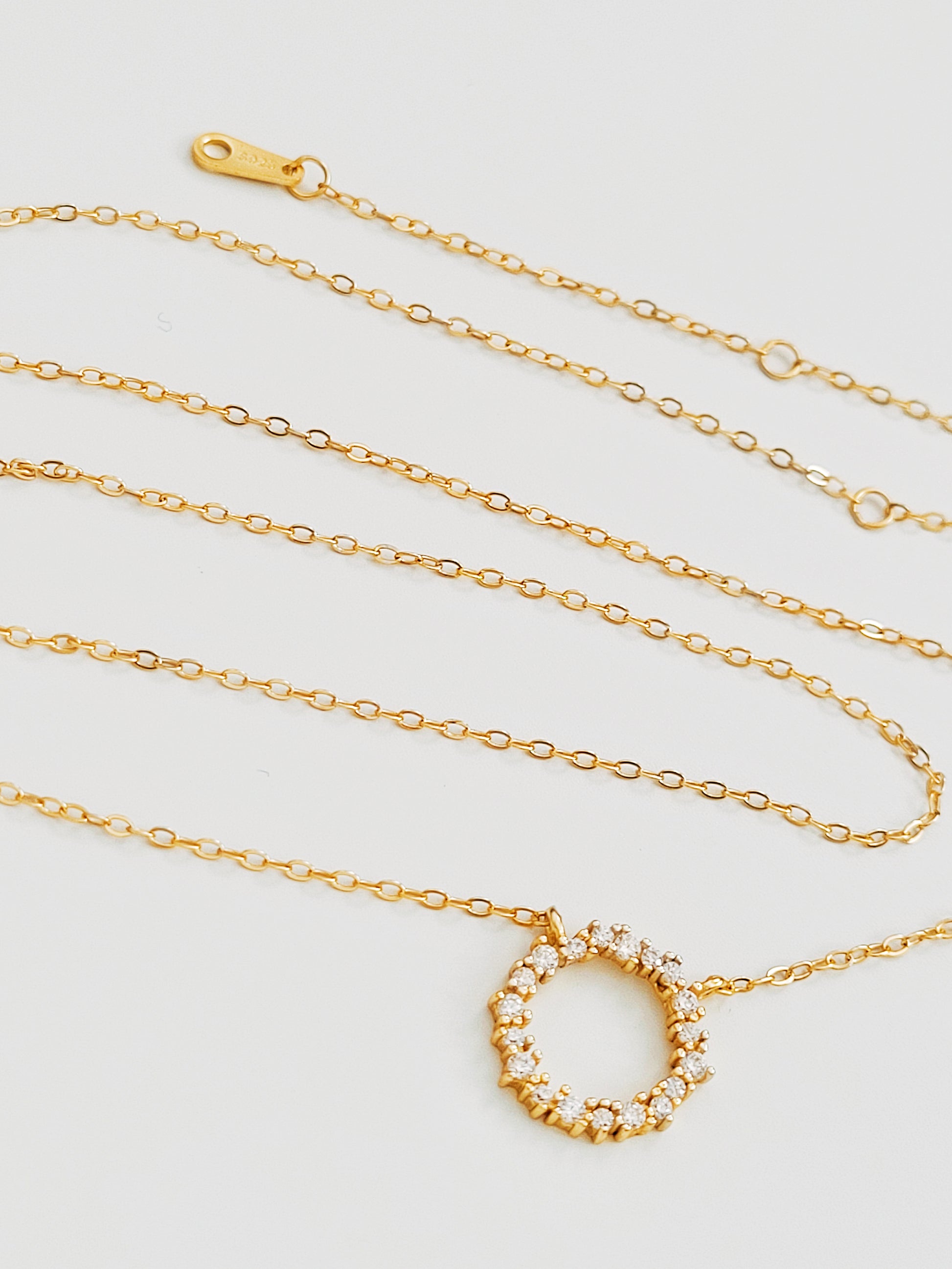 Gold Vermeil Infinity Circle Necklace displayed flat, highlighting the infinity circle pendant.