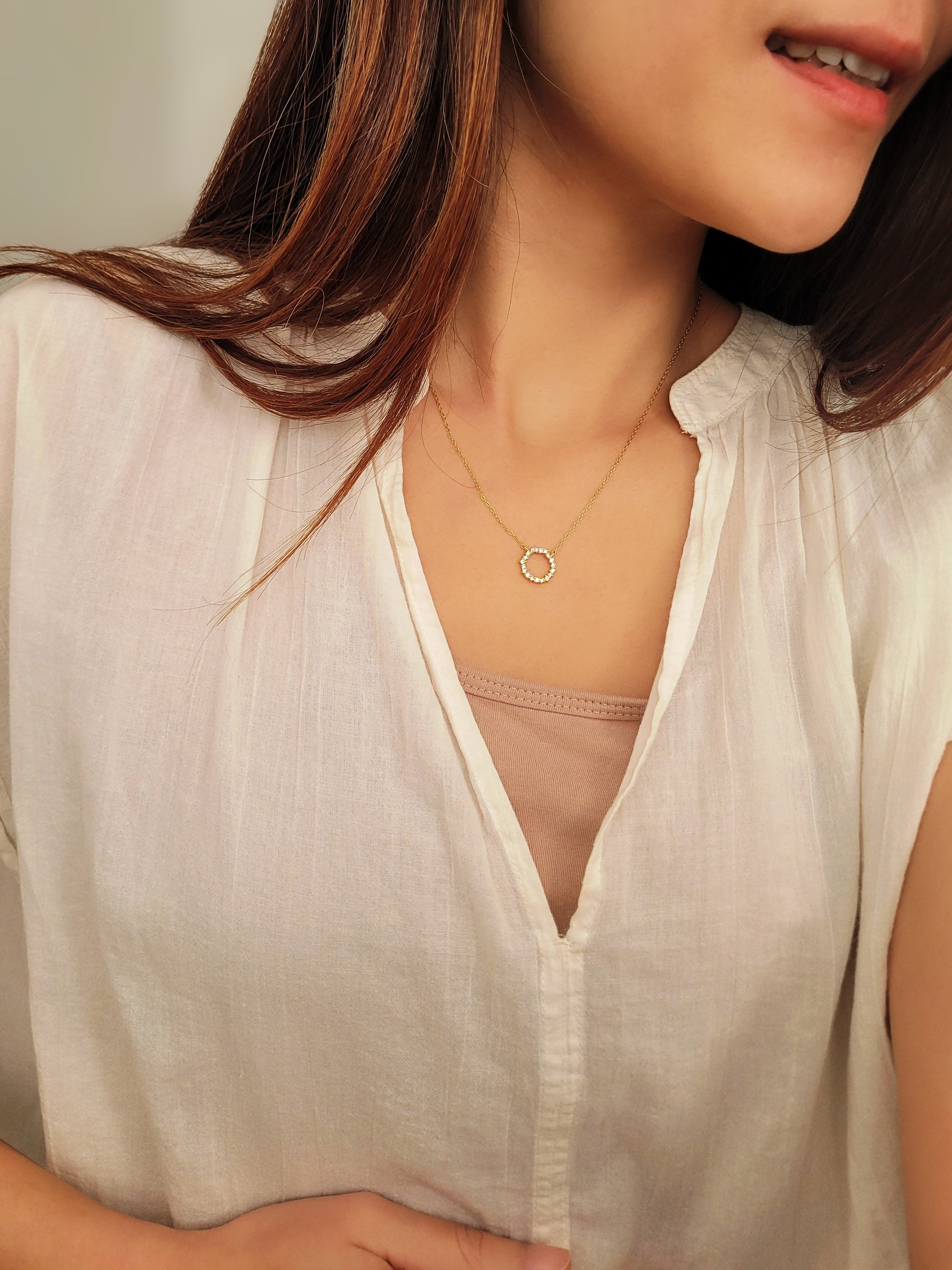 Model wearing Gold Vermeil Infinity Circle Necklace, showcasing its minimalist design.