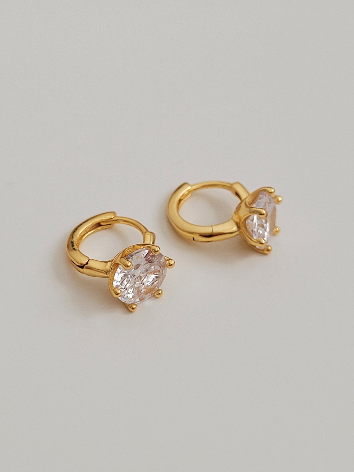 Stylish and dainty solitaire cubic zirconia earrings in gold vermeil finish, ideal for gifting.