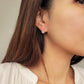 Elegant dangle earrings featuring a sparkling cubic zirconia stone set in 18k gold vermeil, perfect for everyday wear.