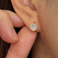 Close-up of a gold vermeil solitaire huggie earring with a large cubic zirconia stone worn on an ear