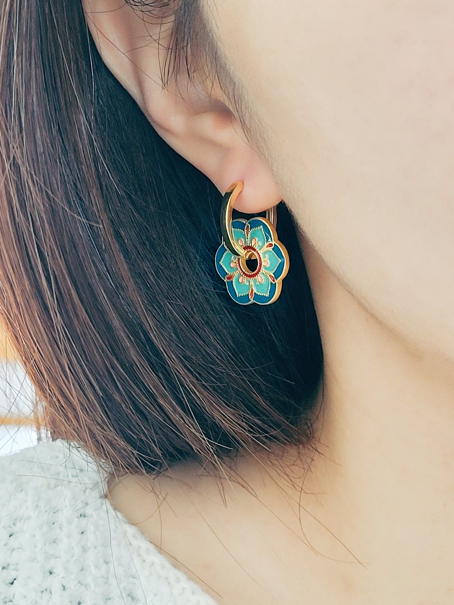 Close up of Green Enamel Flower Portugal Tile earrings.