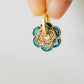 Close up of Green Enamel Flower Portugal Tile earrings.