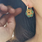 Close up of Green Enamel Flower Portugal Tile earrings.