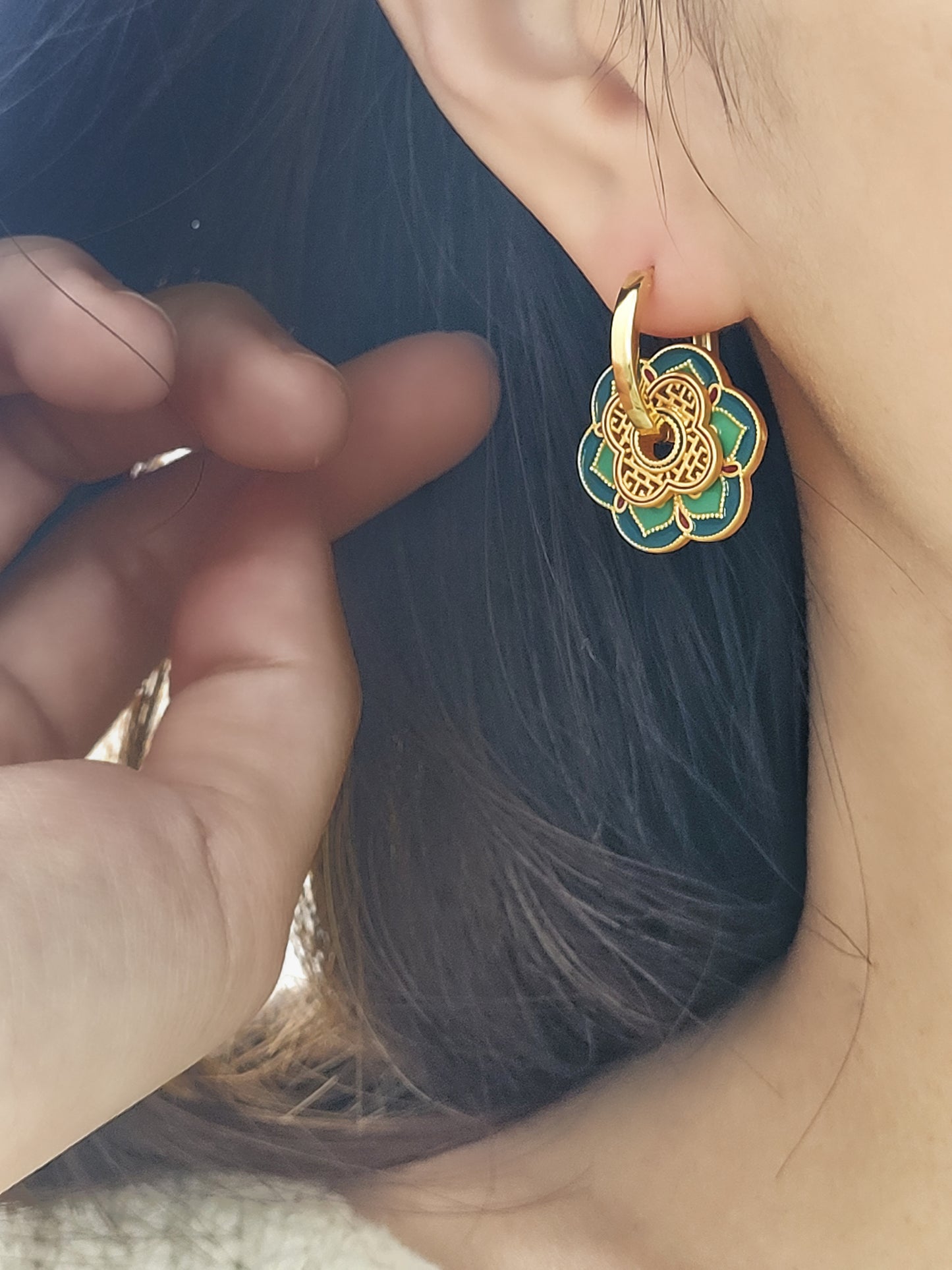 Close up of Green Enamel Flower Portugal Tile earrings.