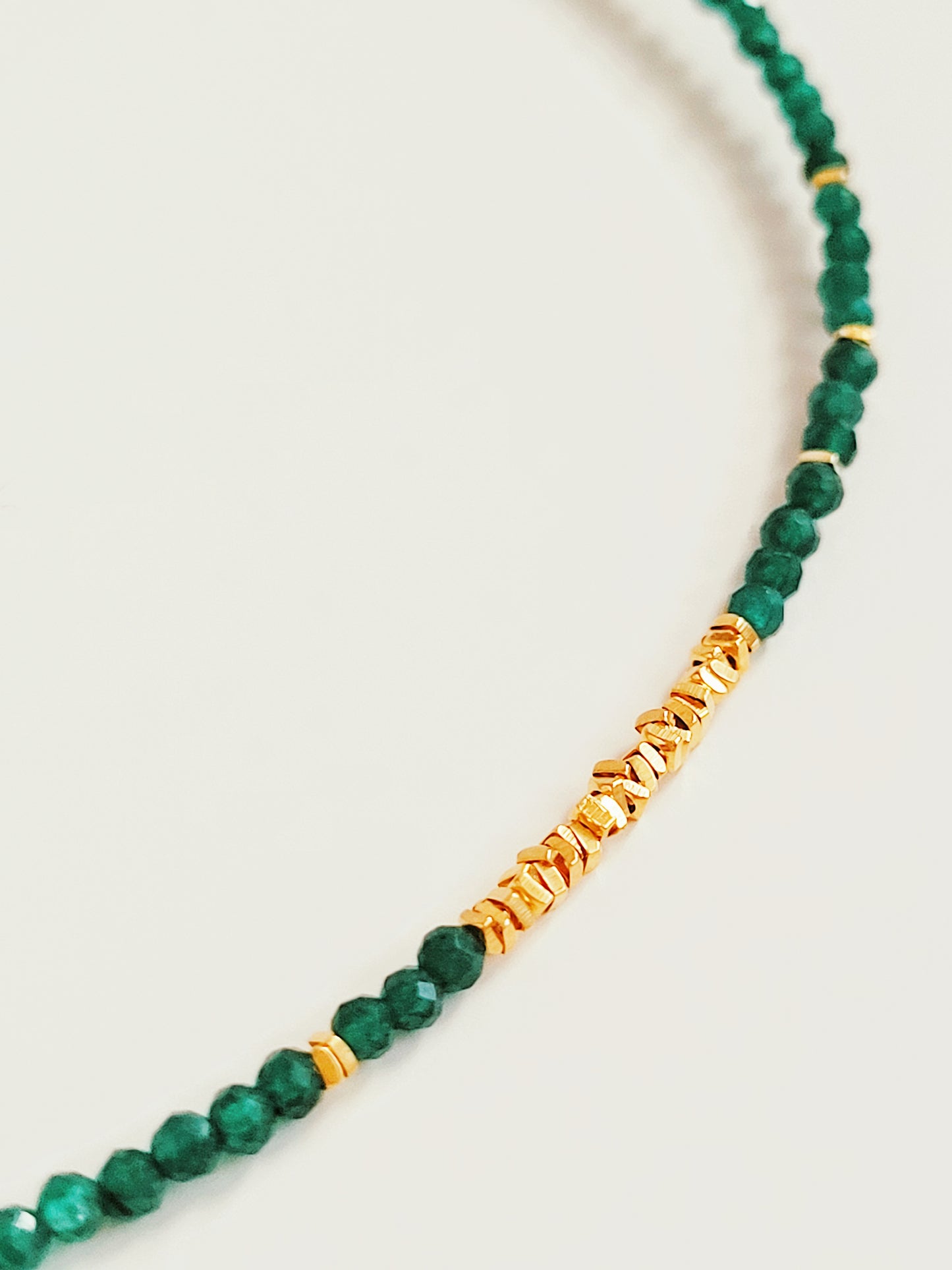 A close-up of a Green Onyx Beaded Necklace with 18k Gold Vermeil beads, showcasing an elegant minimalist design perfect for everyday wear or special occasions.