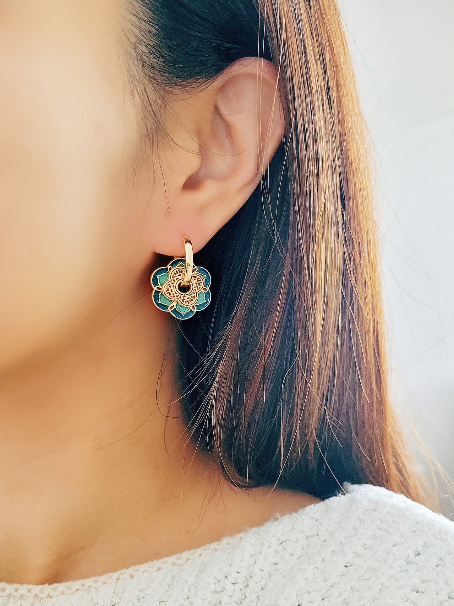 Close up of Green Enamel Flower Portugal Tile earrings.