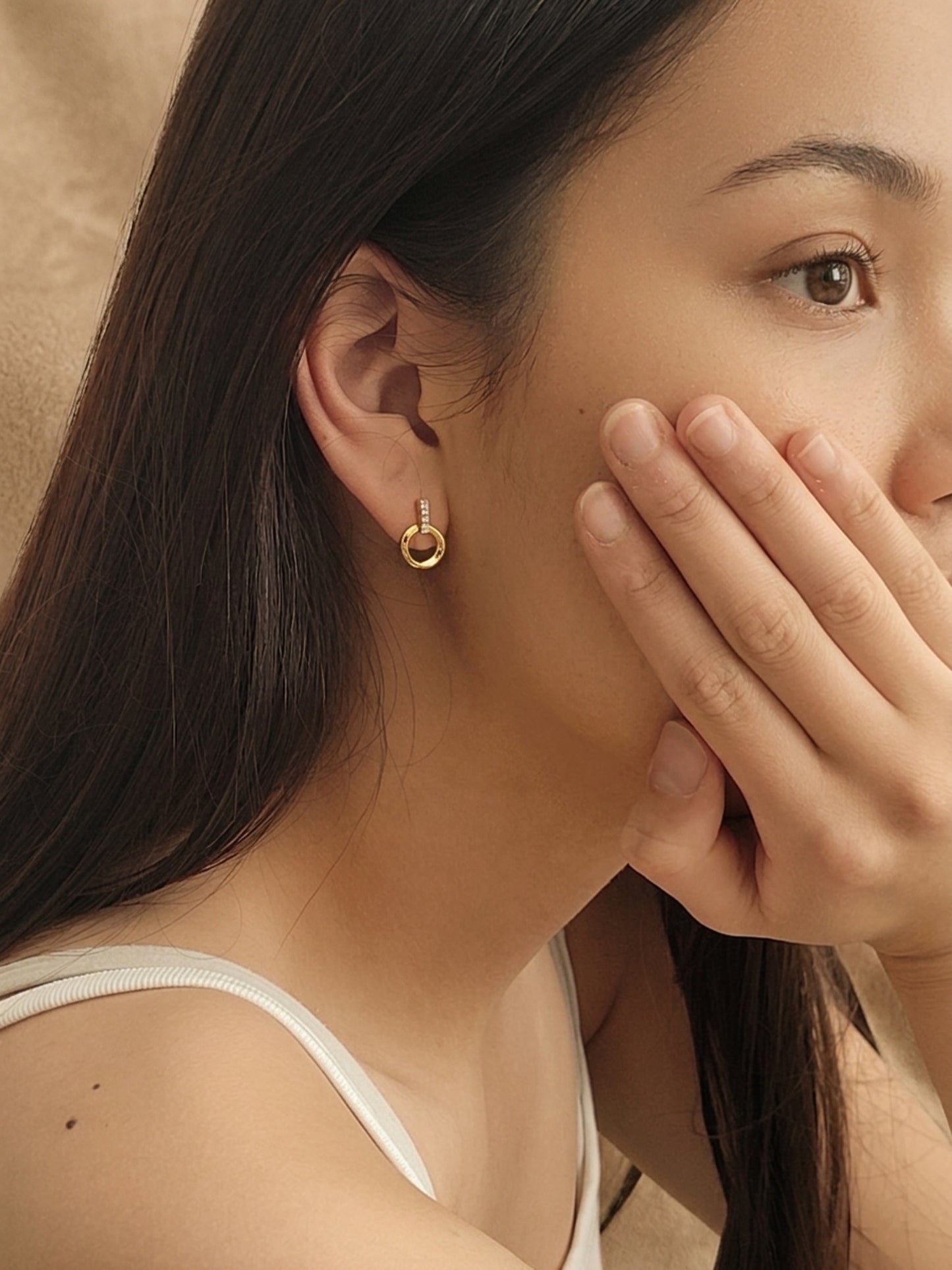 Woman wearing the Halo Drop Stud Earrings crafted in 18k gold vermeil with cubic zirconia accents, simple everyday earrings