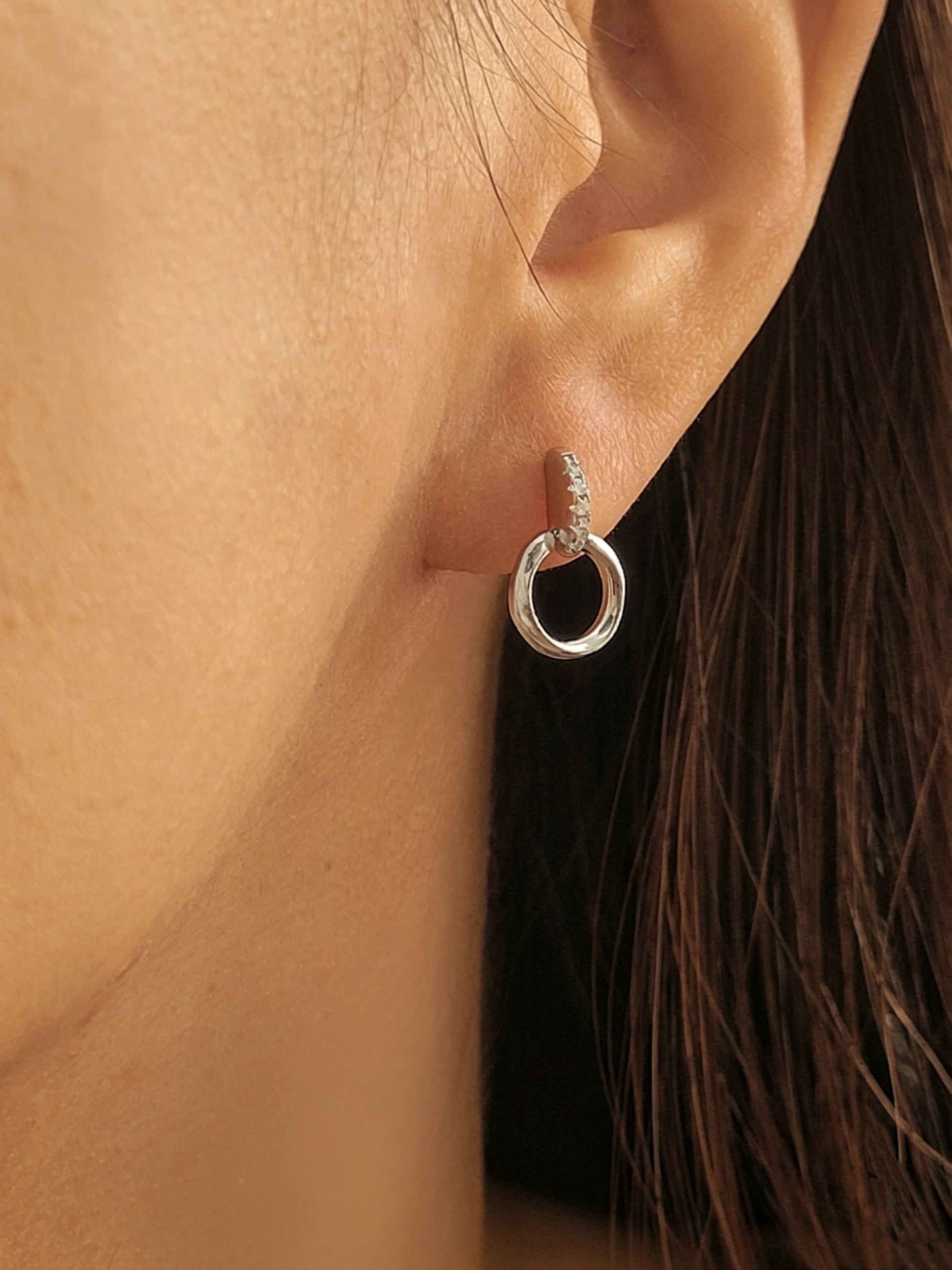 Model wearing Halo Drop Stud Earrings crafted in sterling silver, dainty and minimalist everyday jewellery