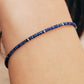A minimalist gemstone bracelet featuring high-quality 2mm royal blue Lapis Lazuli beads paired with 18k gold vermeil accents, creating a delicate and timeless design perfect for stacking or wearing alone.