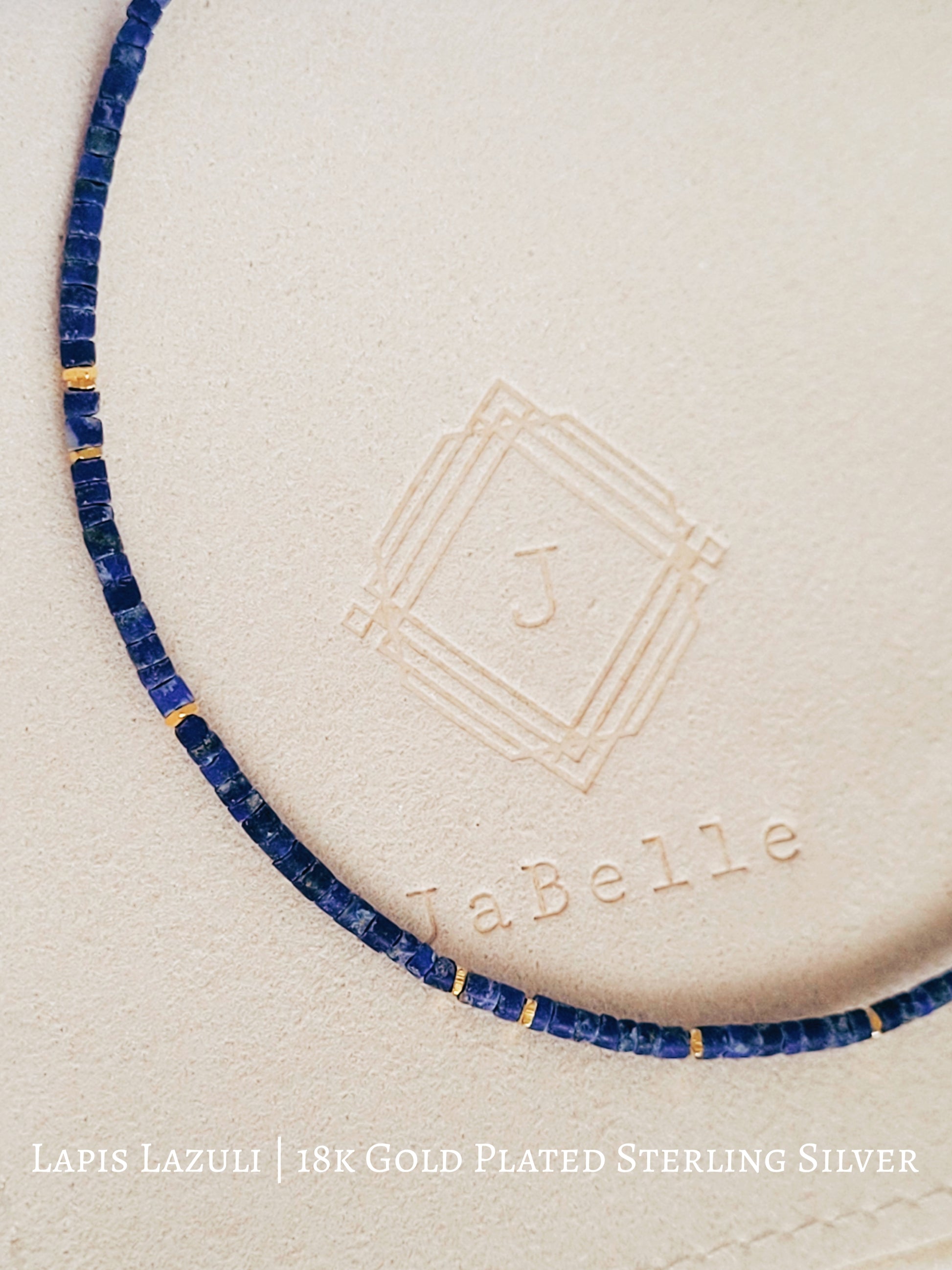 A minimalist gemstone bracelet featuring high-quality 2mm royal blue Lapis Lazuli beads paired with 18k gold vermeil accents, creating a delicate and timeless design perfect for stacking or wearing alone.