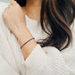 A minimalist gemstone bracelet featuring high-quality 2mm royal blue Lapis Lazuli beads paired with 18k gold vermeil accents, creating a delicate and timeless design perfect for stacking or wearing alone.
