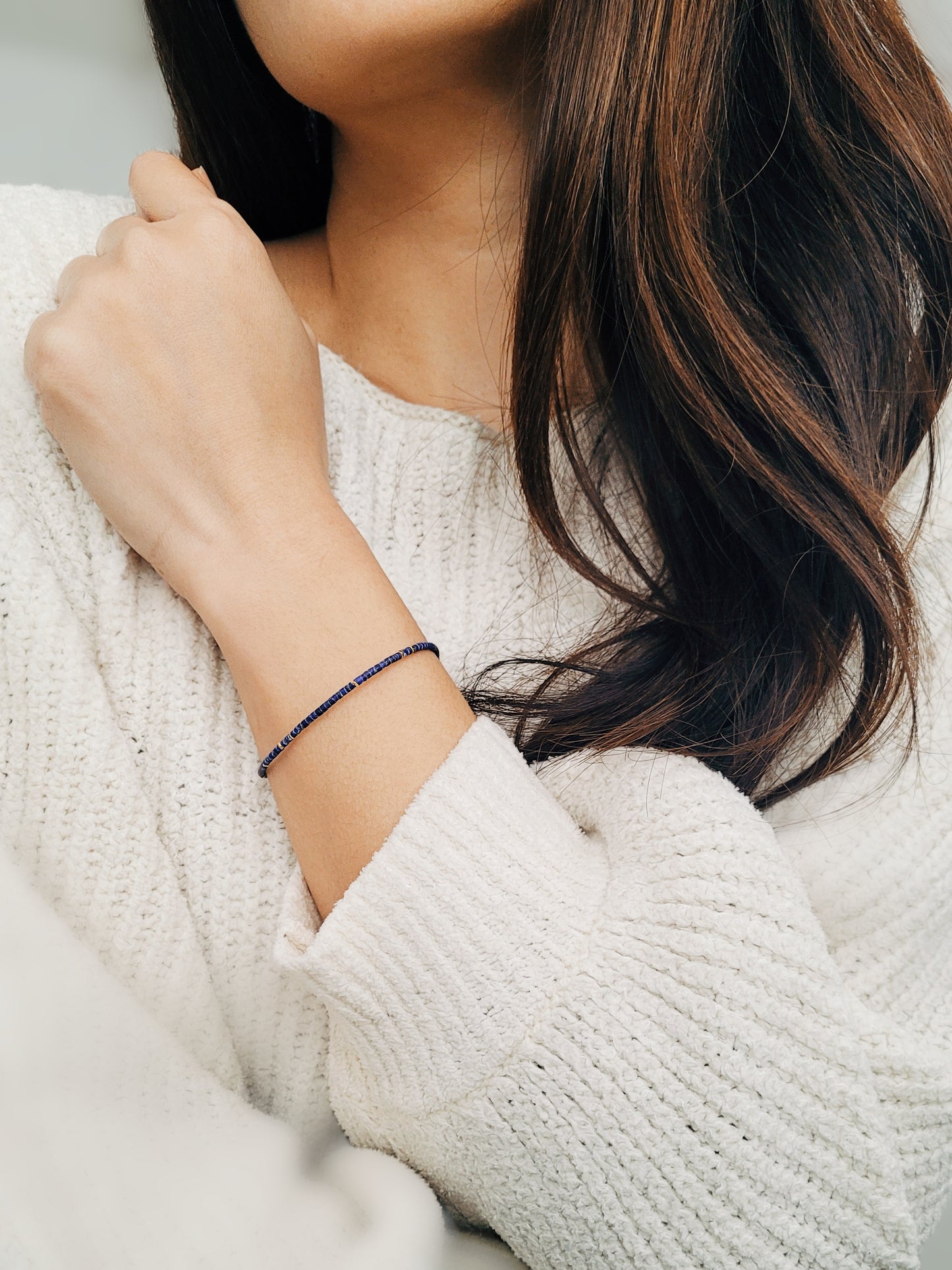 A minimalist gemstone bracelet featuring high-quality 2mm royal blue Lapis Lazuli beads paired with 18k gold vermeil accents, creating a delicate and timeless design perfect for stacking or wearing alone.