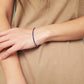 A minimalist gemstone bracelet featuring high-quality 2mm royal blue Lapis Lazuli beads paired with 18k gold vermeil accents, creating a delicate and timeless design perfect for stacking or wearing alone.