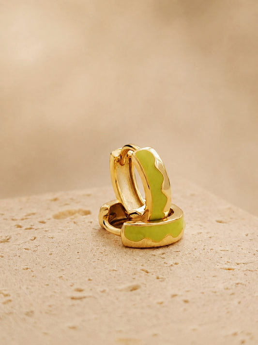 A pair of Green Enamel Huggie hoops in gold plated sterling silver on an aesthetic colored stone, dainty minimalist everyday earrings.