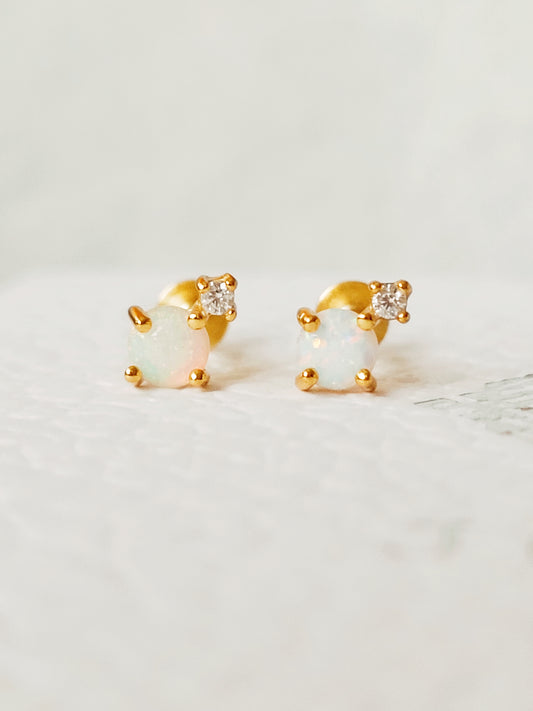 Mini round opal stud earrings in 18K gold vermeil on a white background, emphasizing the minimalist design.