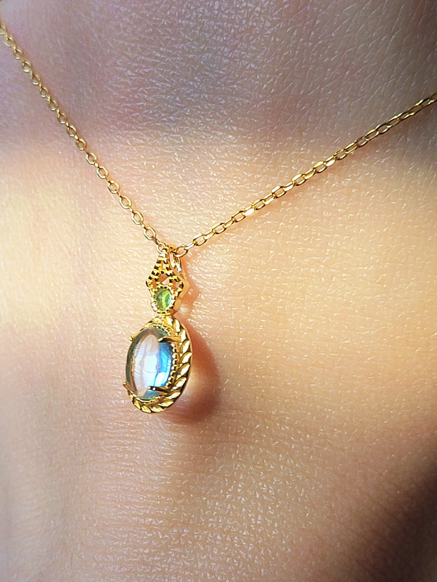 Vintage inspired adjustable gold-plated chain necklace featuring blue topaz and green gemstone accents.  Perfect anniversary gift for her.