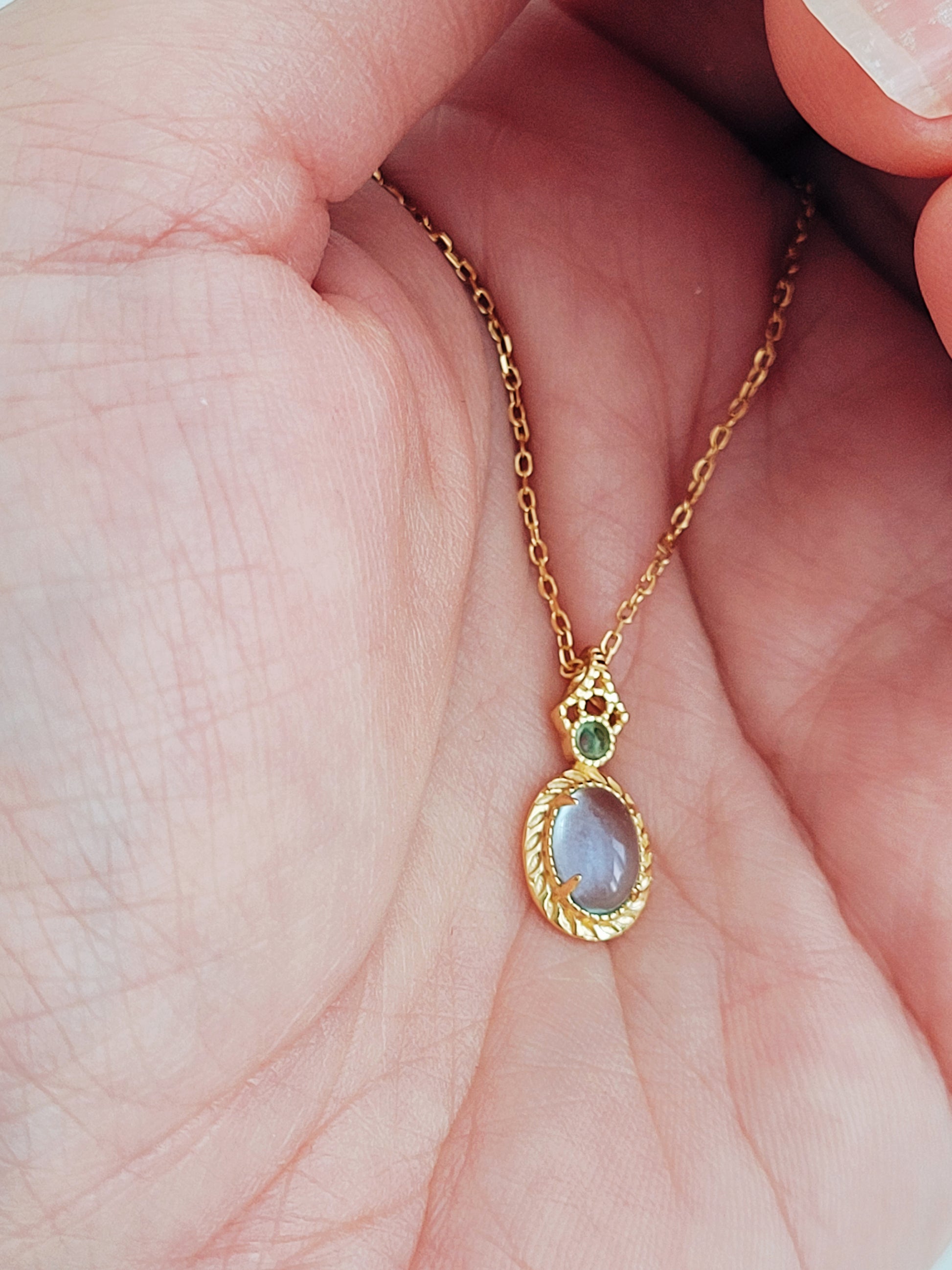 Vintage inspired adjustable gold-plated chain necklace featuring blue topaz and green gemstone accents.  Perfect birthday gift for her.